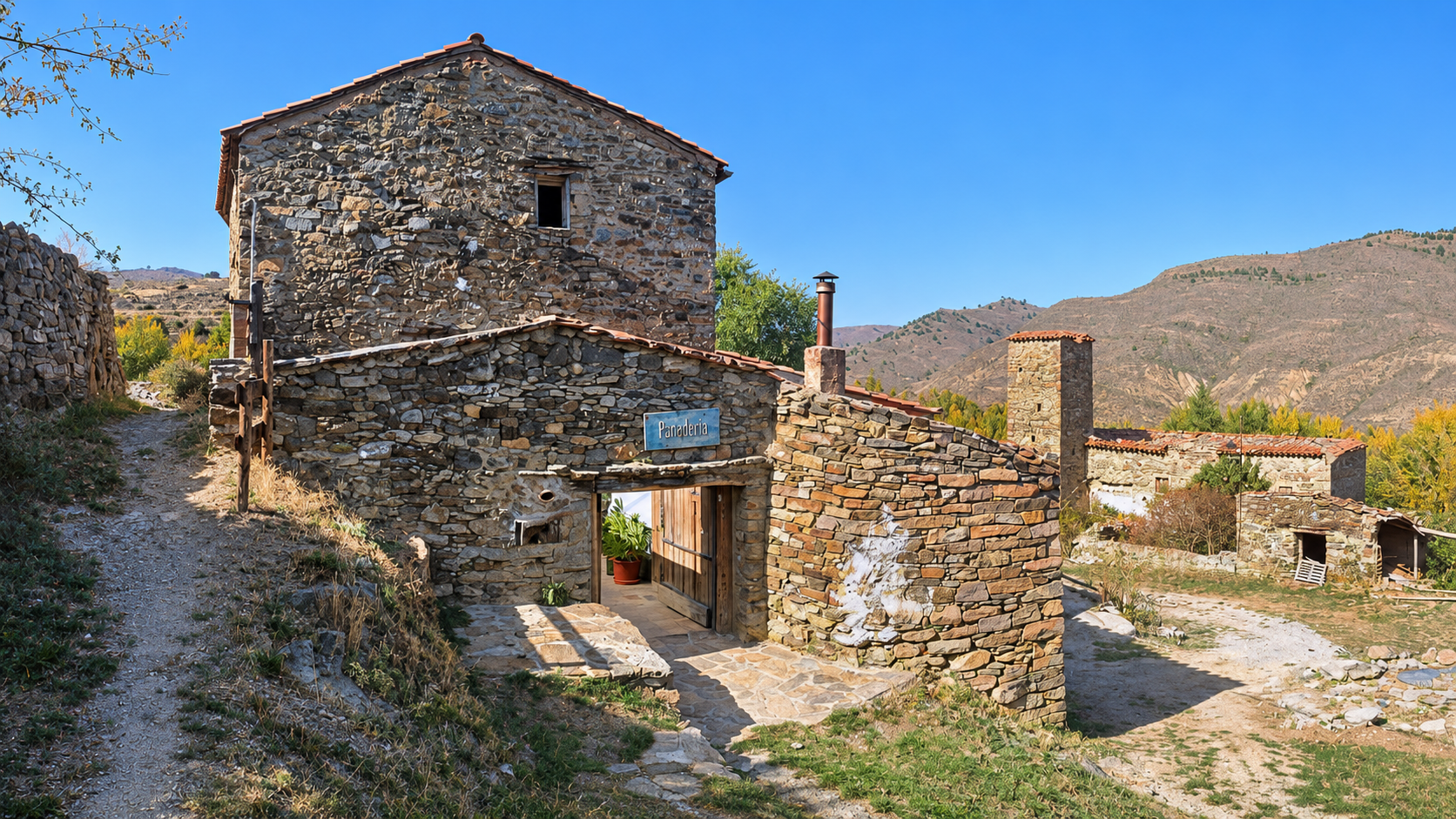 Fachada de piedra del obrador artesano ArtePania en Poyales, La Rioja